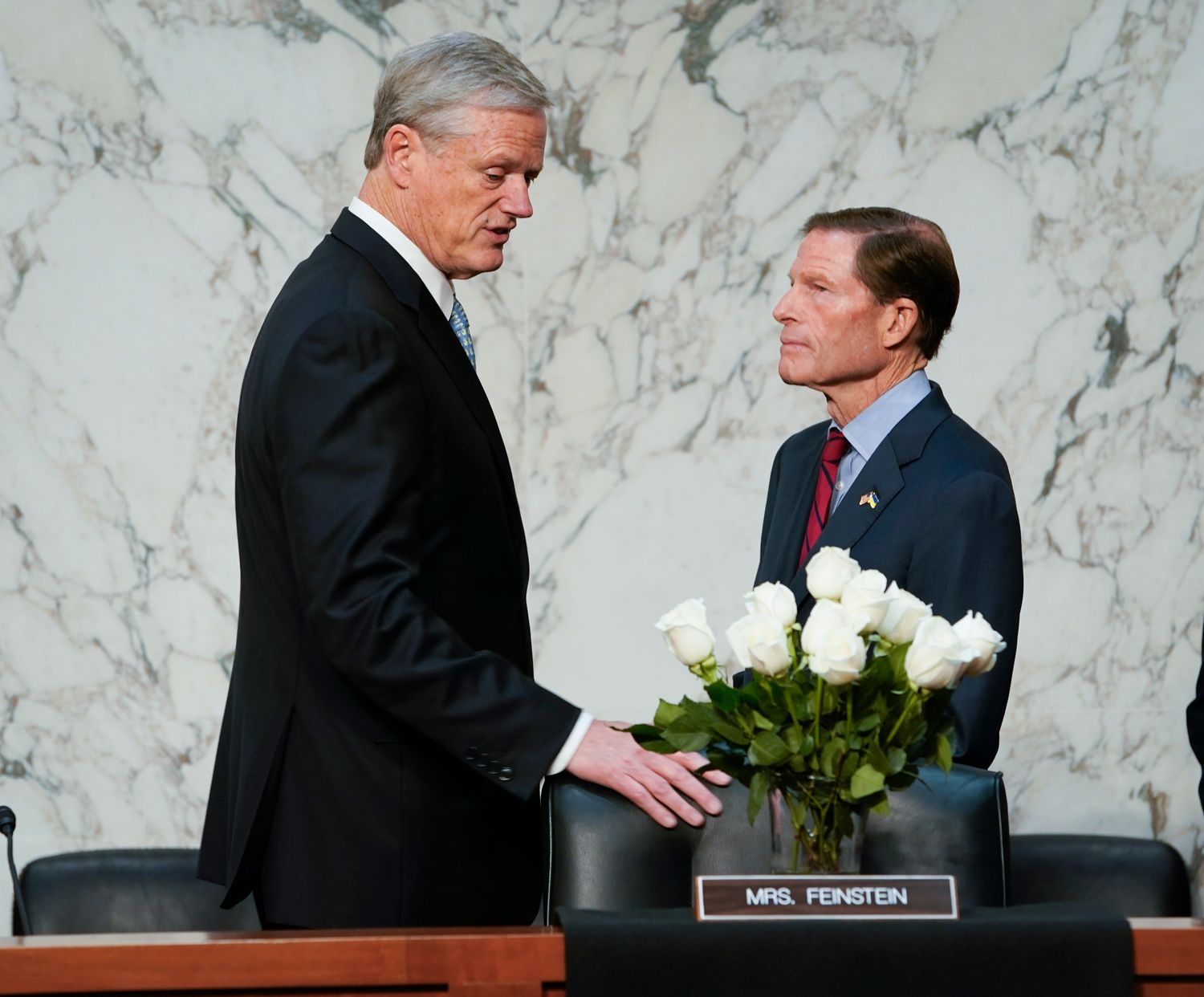 Oct 17, 2023; Washington, DC, USA; Senator Richard Blumenthal (D-CT), right, speaking with NCAA President Charlie Baker, left, before the start of the Senate Judiciary Committee hearing \"Name, Image, and Likeness, and the Future of College Sports\" on Tuesday, Oct. 17, 2023 standing in front of a bouquet of flowers in memory of Senator Dianne Feinstein who passed away on September 29, 2023. Mandatory Credit: Jack Gruber-USA TODAY